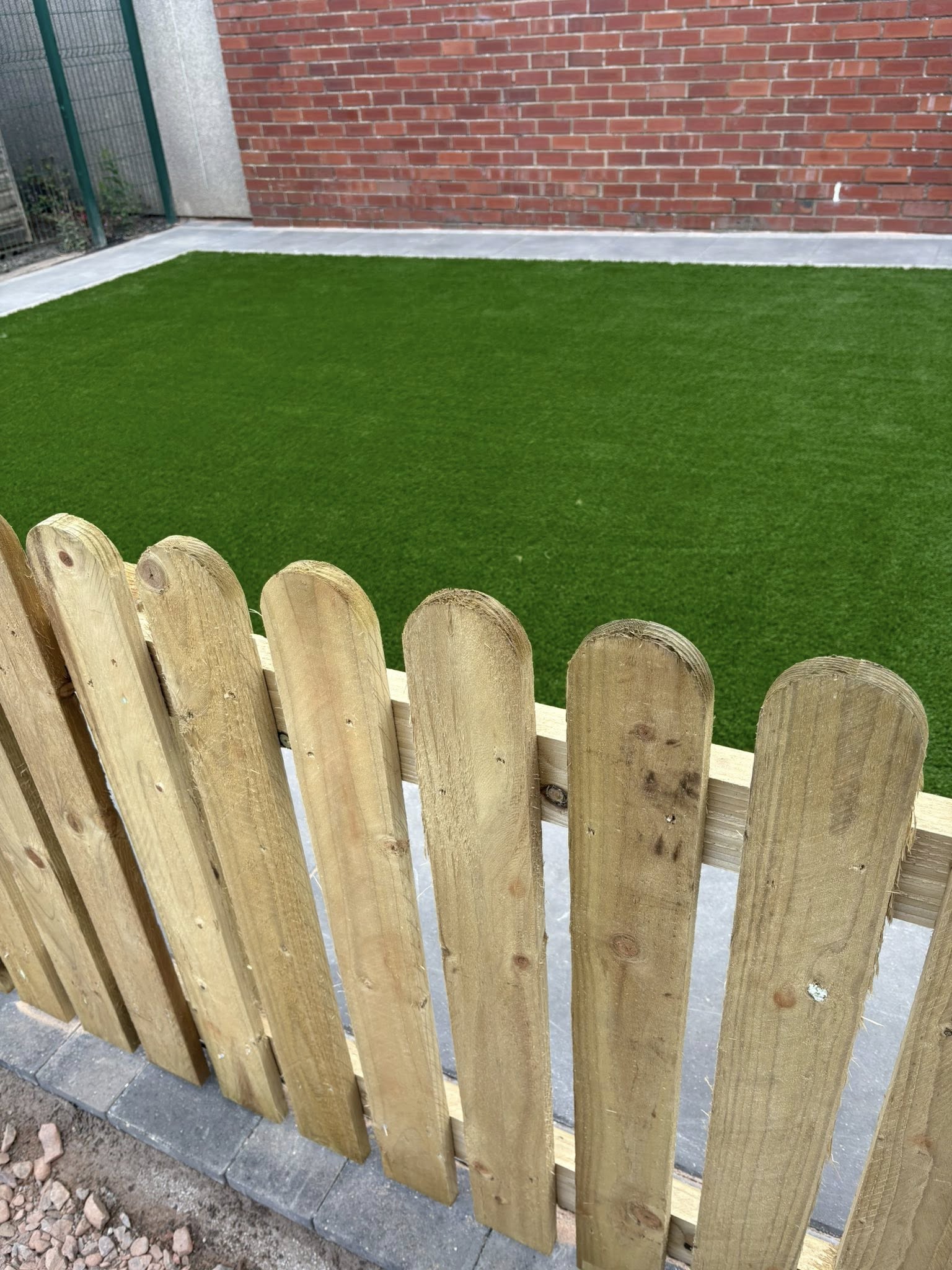 Artificial grass with picket fence — completed project