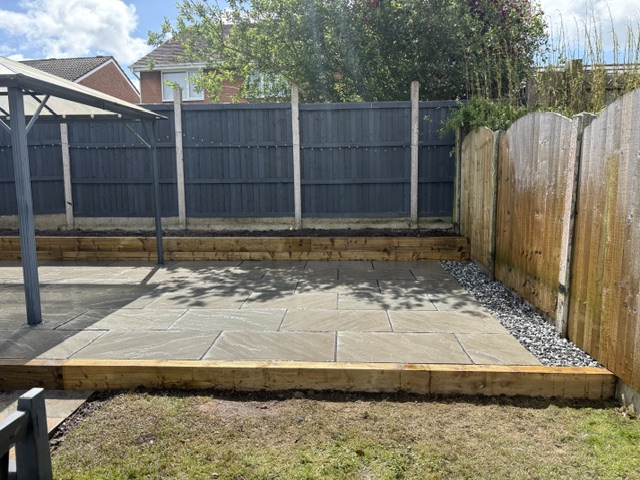 Raised patio with sleeper edging — completed project