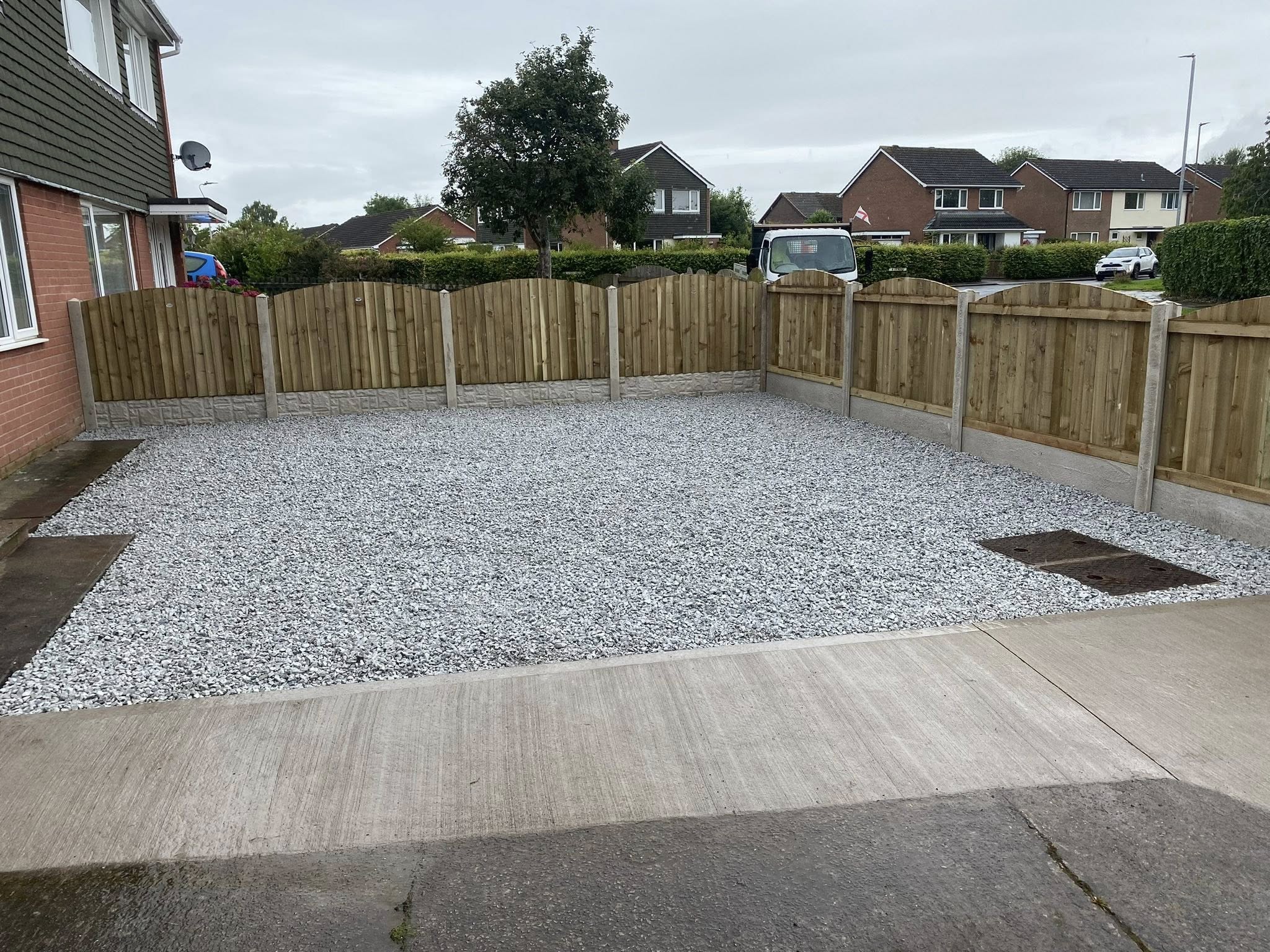 Gravel driveway with fencing — completed project