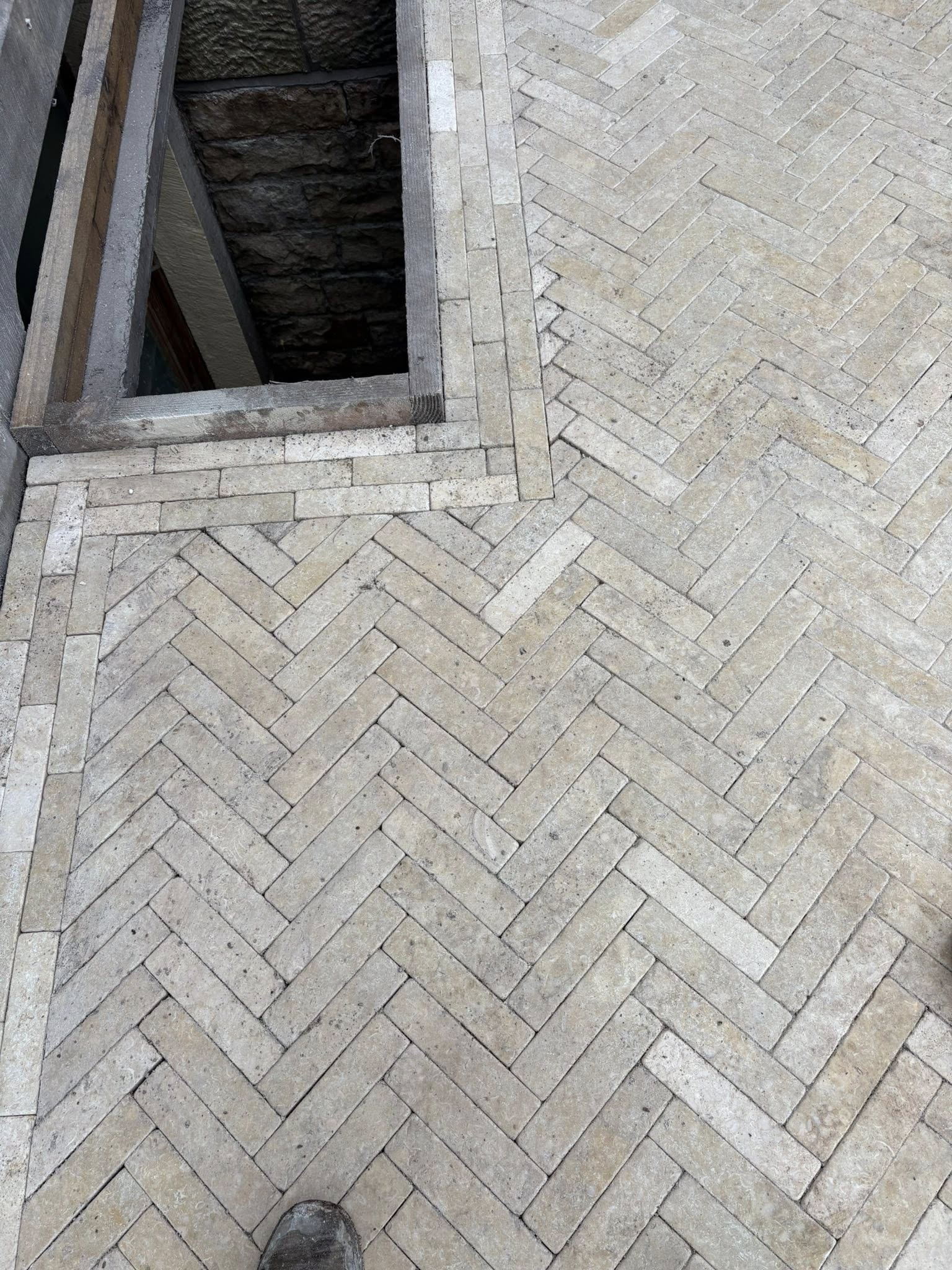 Herringbone travertine paving — completed project